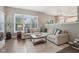 Comfortable living room with a large sectional sofa, wood floors, and a neutral color palette at 427 Quincy Pl, Westfield, IN 46074