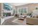 Cozy living room features a brick fireplace, large sectional sofa, and plenty of natural light at 427 Quincy Pl, Westfield, IN 46074