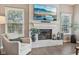 Living room featuring a white brick fireplace, hardwood floors, and lots of natural light at 427 Quincy Pl, Westfield, IN 46074