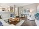 Inviting living room with a large sectional sofa, hardwood floors, and an open floor plan at 427 Quincy Pl, Westfield, IN 46074
