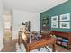 Inviting home office featuring a handsome wooden desk, office chair, and stylish decor against an accent wall at 427 Quincy Pl, Westfield, IN 46074