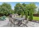 Outdoor patio boasts a dining set, a grill, playhouse, and lush landscaping at 427 Quincy Pl, Westfield, IN 46074