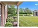 Scenic backyard view showcasing the property's lush lawn and pond at 4295 Washington Blvd, Plainfield, IN 46168