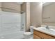 Bathroom featuring shower-tub combo and vanity with wood cabinet at 4295 Washington Blvd, Plainfield, IN 46168