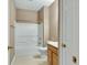 Clean bathroom with a shower-tub combo and a single sink vanity with wooden cabinets at 4295 Washington Blvd, Plainfield, IN 46168