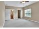 Neutral bedroom featuring access to a bathroom and grey carpet flooring at 4295 Washington Blvd, Plainfield, IN 46168