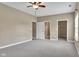 Neutral bedroom featuring access to a bathroom and grey carpet flooring at 4295 Washington Blvd, Plainfield, IN 46168