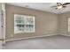 Neutral bedroom featuring dual windows and grey carpet flooring at 4295 Washington Blvd, Plainfield, IN 46168
