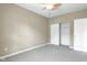 A cozy bedroom featuring neutral carpet, neutral paint, and a closet at 4295 Washington Blvd, Plainfield, IN 46168