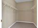 Walk-in closet featuring wire shelving and neutral carpet flooring at 4295 Washington Blvd, Plainfield, IN 46168