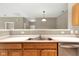 Kitchen with stainless steel appliances, countertop, and adjacent living room at 4295 Washington Blvd, Plainfield, IN 46168