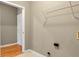 Bright laundry area features a hanging rack and connections for a washer and dryer for added convenience at 4295 Washington Blvd, Plainfield, IN 46168