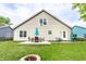 Expansive backyard with patio, dining set, and fire pit offering great outdoor living space at 4380 Dunsany Ct, Indianapolis, IN 46254