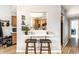 Cozy dining area with a breakfast bar overlooking the kitchen, perfect for casual meals and entertaining guests at 4380 Dunsany Ct, Indianapolis, IN 46254