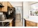 Well-organized kitchen showcases ample counter space, wood cabinets, and a modern stainless steel refrigerator at 4380 Dunsany Ct, Indianapolis, IN 46254