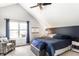 Bright main bedroom features ample natural light, a comfortable bed, and a cozy reading corner at 4380 Dunsany Ct, Indianapolis, IN 46254