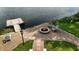 Overhead view of backyard with fire pit, dock, and lake creating a relaxing outdoor space at 4443 Mallard Pt, Columbus, IN 47201