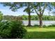Lush backyard with a view of the lake featuring beautiful cone flowers at 4443 Mallard Pt, Columbus, IN 47201