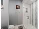 Modern bathroom features a glass-enclosed shower with tiled walls and a toilet at 4443 Mallard Pt, Columbus, IN 47201