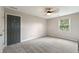 Simple bedroom with neutral colors and lots of carpet, providing a clean and relaxing atmosphere at 4443 Mallard Pt, Columbus, IN 47201