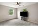 Well-lit bedroom with two windows, a ceiling fan, and carpet, providing a bright living space at 4443 Mallard Pt, Columbus, IN 47201