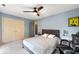 Cozy bedroom with blue walls, carpet and a ceiling fan, creating a comfortable personal space at 4443 Mallard Pt, Columbus, IN 47201