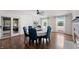 Dining room with hardwood floors, fireplace, and sliding doors to outdoor living space at 4443 Mallard Pt, Columbus, IN 47201