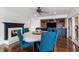Dining room featuring a fireplace, hardwood floors, and built-in entertainment center at 4443 Mallard Pt, Columbus, IN 47201