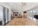 Open-concept kitchen features granite island, stainless appliances, and fireplace visible in background at 4443 Mallard Pt, Columbus, IN 47201