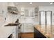 Kitchen with white cabinets, granite countertops, stainless steel appliances, and large gas range at 4443 Mallard Pt, Columbus, IN 47201