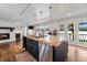 Kitchen with island, pendant lighting, fireplace, and deck access at 4443 Mallard Pt, Columbus, IN 47201