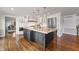 Kitchen with granite island, stainless steel appliances, and white cabinetry at 4443 Mallard Pt, Columbus, IN 47201