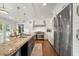 Bright kitchen featuring a large island, stainless steel appliances, and open concept design at 4443 Mallard Pt, Columbus, IN 47201