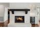 Living room with brick fireplace and custom cabinets featuring beverage fridge at 4443 Mallard Pt, Columbus, IN 47201