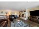Comfortable living room with a fireplace, TV, and multiple seating options at 4443 Mallard Pt, Columbus, IN 47201