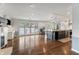 Open floor plan with hardwood floors and a kitchen featuring a large center island at 4443 Mallard Pt, Columbus, IN 47201