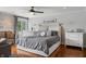 Bright main bedroom with stylish decor, hardwood floors, and large windows creating a peaceful retreat at 4443 Mallard Pt, Columbus, IN 47201