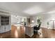 Open office space with a view into the living room, hardwood floors, and a built-in bookcase at 4443 Mallard Pt, Columbus, IN 47201