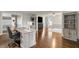 Bright office space with hardwood floors and a view into an adjacent living area at 4443 Mallard Pt, Columbus, IN 47201