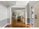 Office space featuring hardwood floors, a view into the living room, and plenty of natural light at 4443 Mallard Pt, Columbus, IN 47201