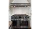 Stainless steel oven with custom range hood and white cabinetry at 4443 Mallard Pt, Columbus, IN 47201