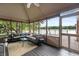 Relax in comfort in this screened porch with vaulted ceilings and views of the lake at 4443 Mallard Pt, Columbus, IN 47201