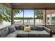 Enjoy the lake view from this screened-in porch featuring comfortable seating and relaxing atmosphere at 4443 Mallard Pt, Columbus, IN 47201