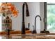 Close up on kitchen island with double sinks and matte black faucet at 4443 Mallard Pt, Columbus, IN 47201