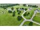 Expansive aerial view of estate with lush lawns, mature trees, pond, and elegant brick home with pool and winding driveway at 4670 N 600 E, Franklin, IN 46131