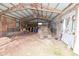 Inside the barn with dirt floor and open storage for equipment and materials at 4670 N 600 E, Franklin, IN 46131