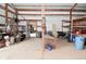 View of the barn interior with white walls and ceiling, divided by a support beam at 4670 N 600 E, Franklin, IN 46131