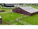 Spacious red barn featuring a metal roof, large sliding doors, and ample green space at 4670 N 600 E, Franklin, IN 46131