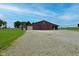 Exterior view of the barn on the property featuring blue skies and gravel driveway at 4670 N 600 E, Franklin, IN 46131