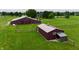 Aerial view of red barn with metal roof and green pasture at 4670 N 600 E, Franklin, IN 46131